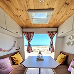 Static Camper In Front Of The Sea